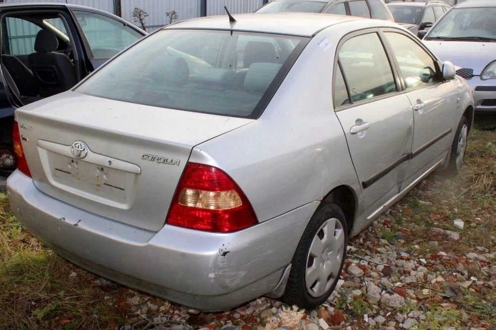 Toyota Corolla E12 chlapacz lewy przód – zdjęcie 6